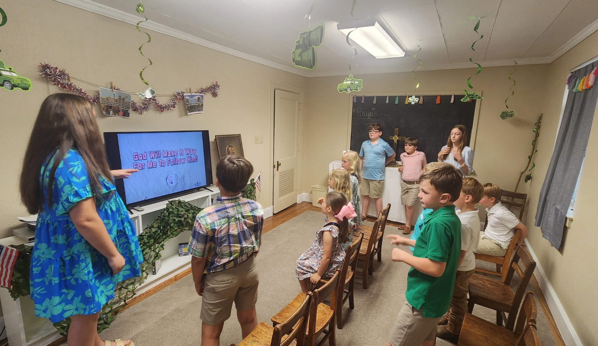 Children singing and worshipping together in Children's Church