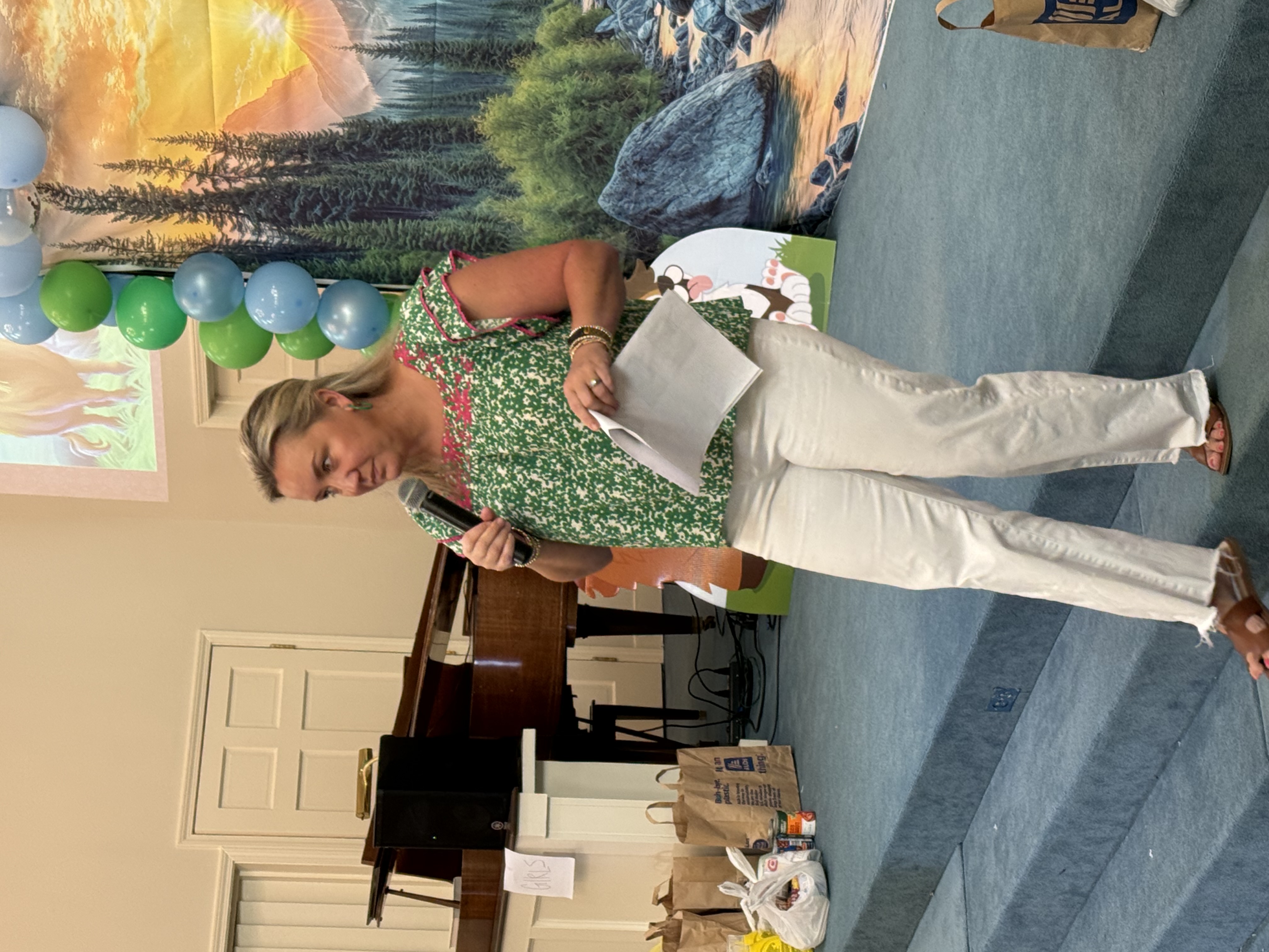 VBS leader addressing children during the program